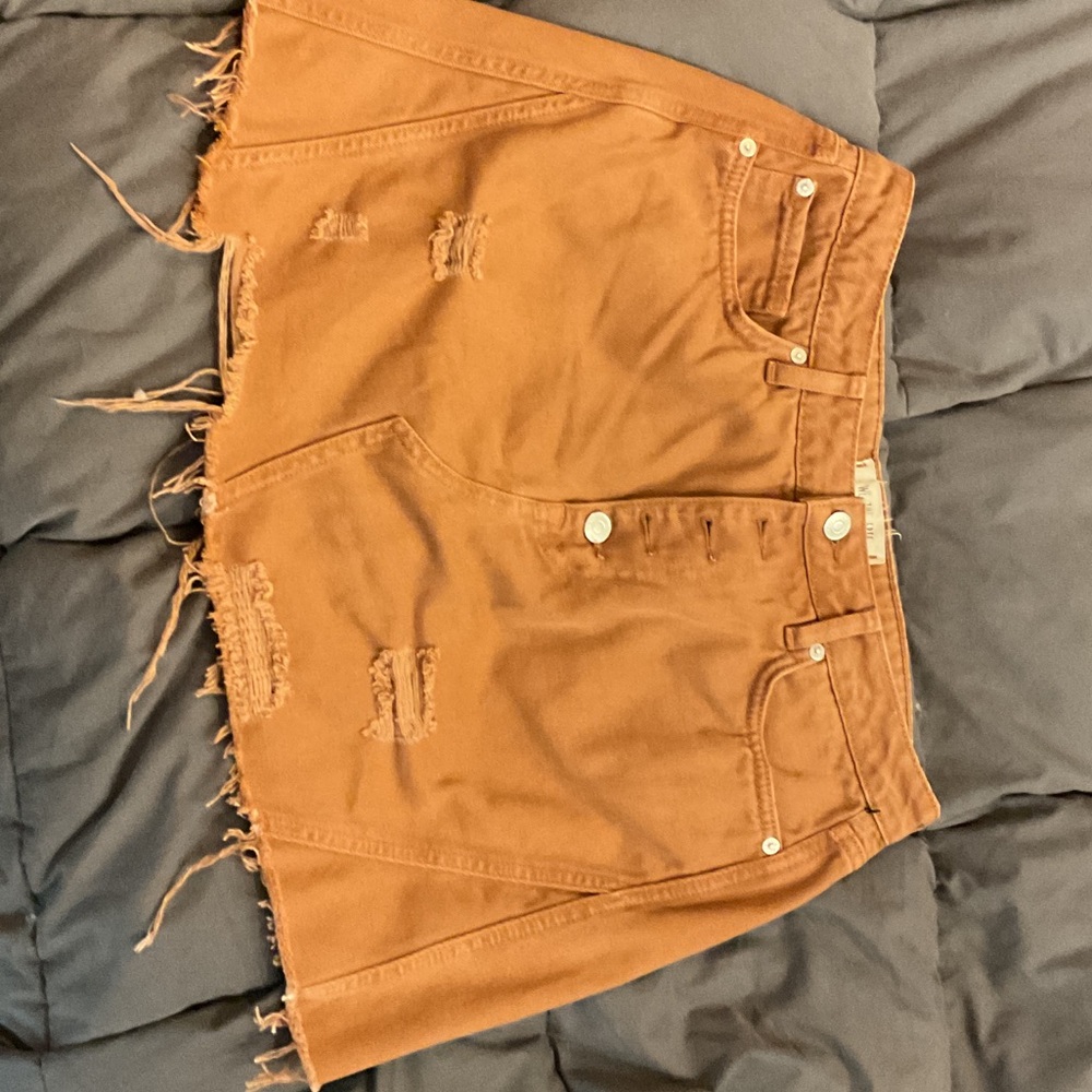 We The Free High-Rise Distressed Jean mini skirt in Rust Orange brown